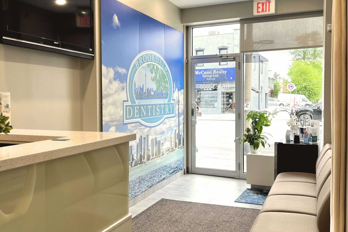 Front entrance of dental office with large sign